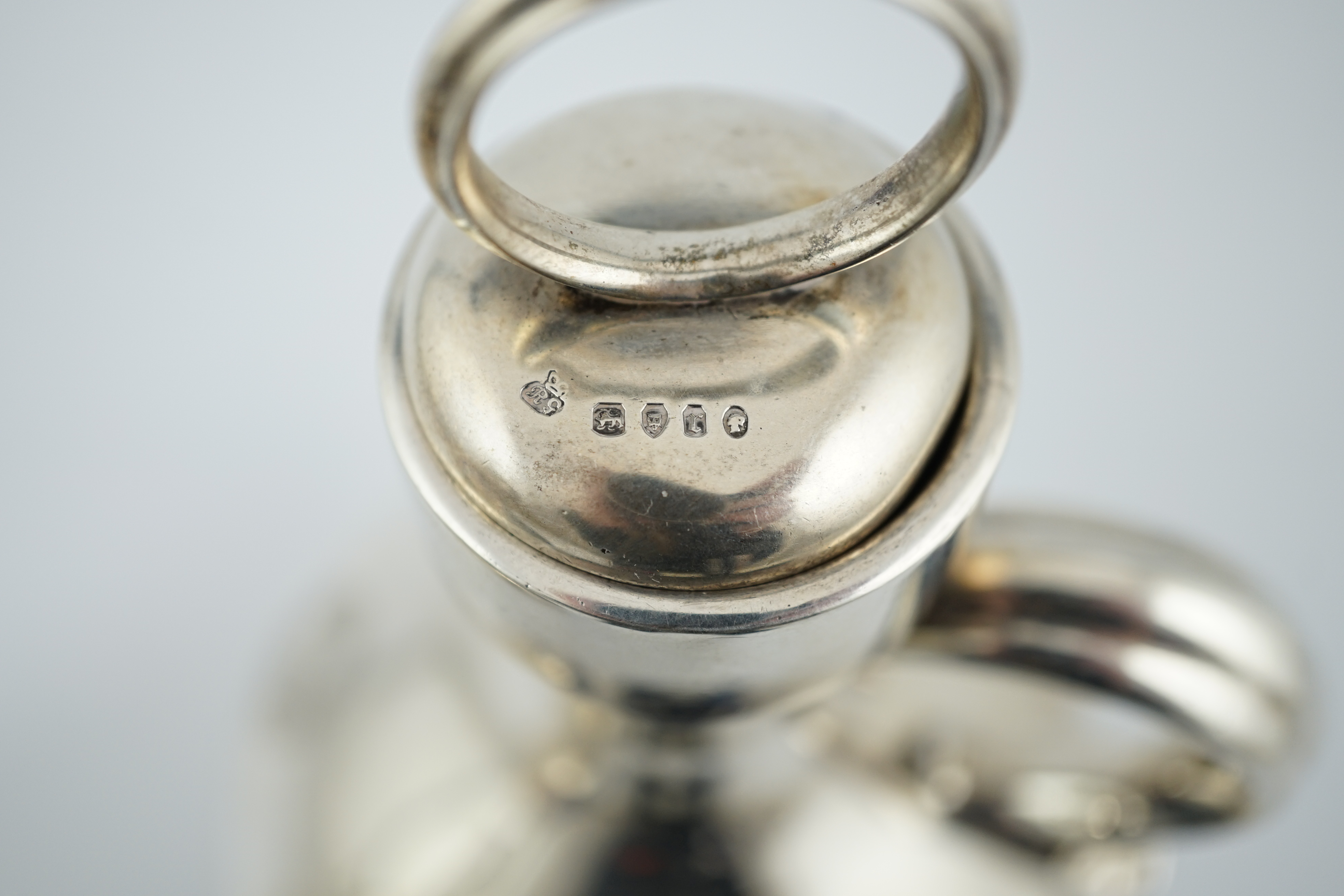 A pair of Victorian silver single handled ovoid water/wine jugs with stoppers, by R & S Garrard & Co